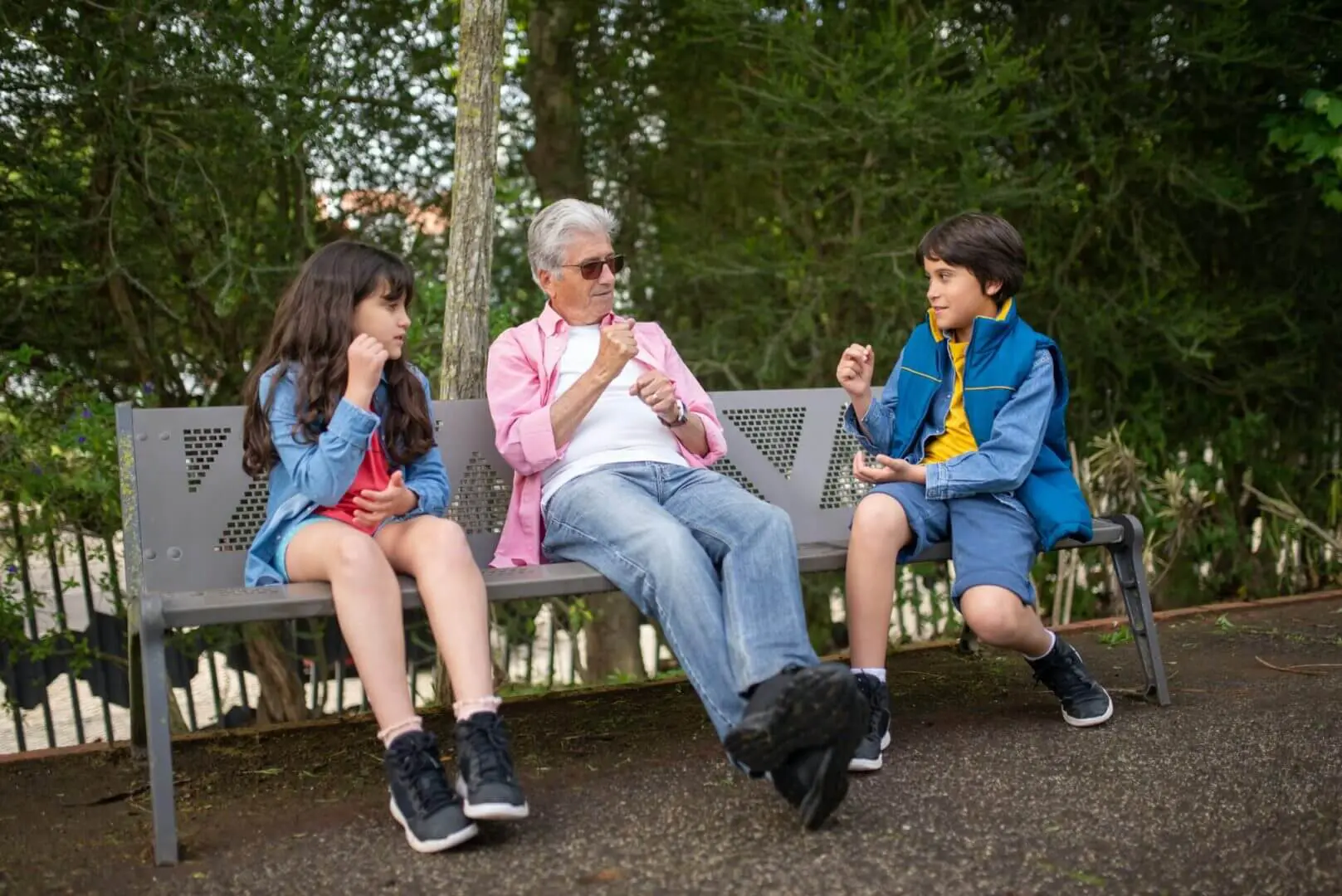 Grandparent with kids on park bench