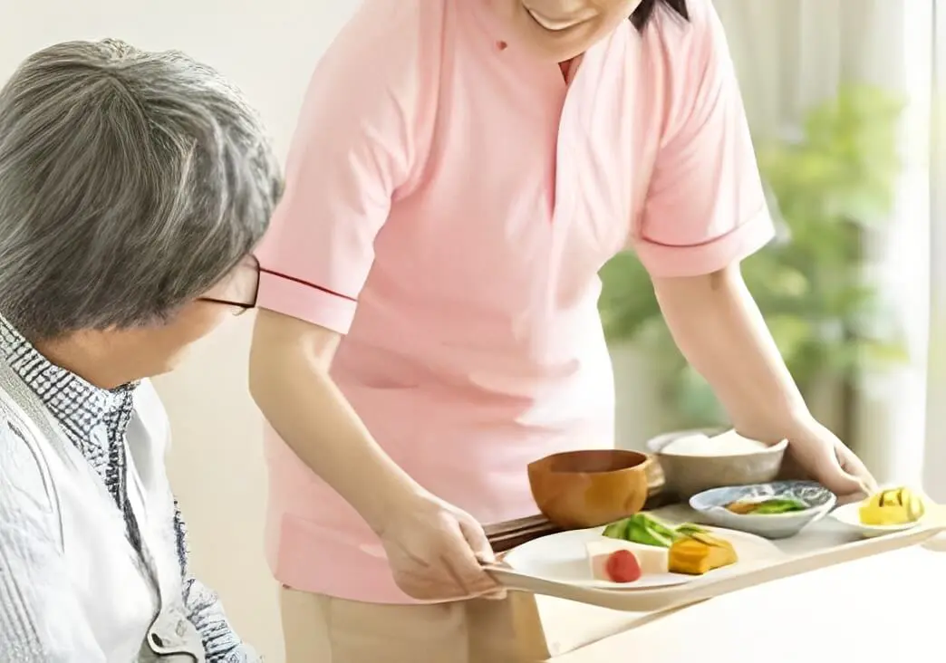 Healthcare worker with food tray