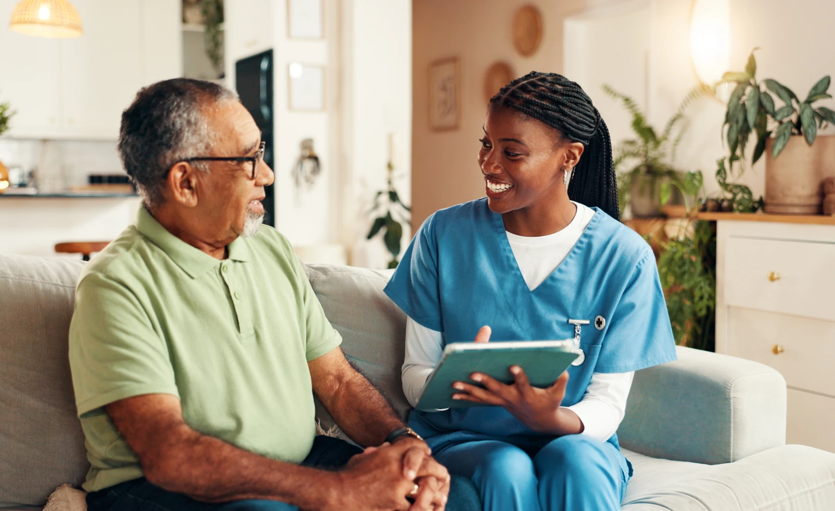 Elderly man with nurse discussing care